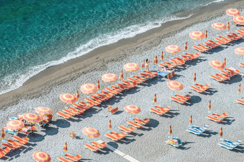 Beach umbrellas and lounge chairs.