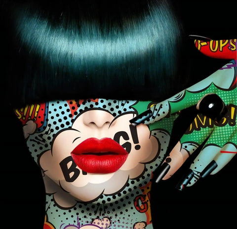 A woman with green hair and a black wig