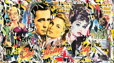 A close up of a collage of posters on a wall