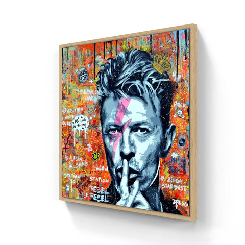 Street art portrait with a ’shh’ gesture against a vibrant graffiti background.
