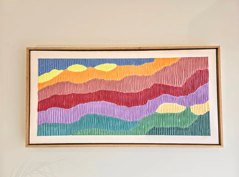 Colorful abstract painting with wavy horizontal stripes in a wooden frame.