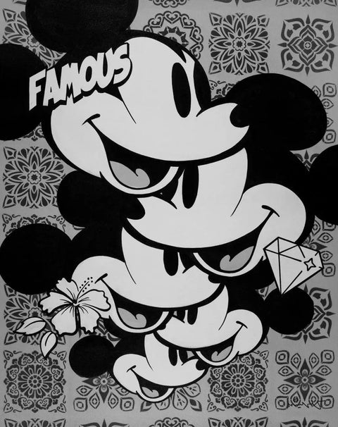 Mickey mouse with a bow and a bow tie on his head