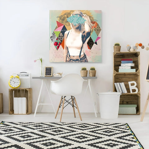 A white desk with a white chair and a painting on the wall