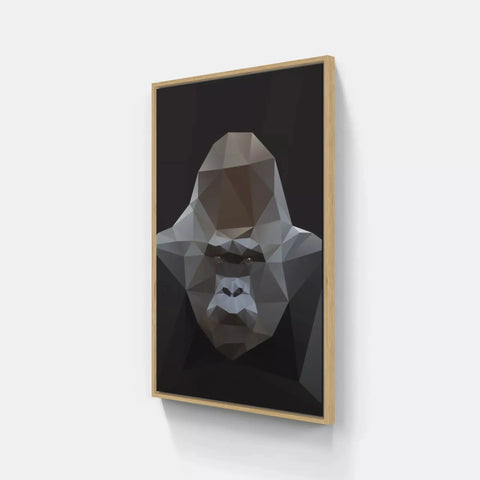 A framed print of a gorilla head on a wall