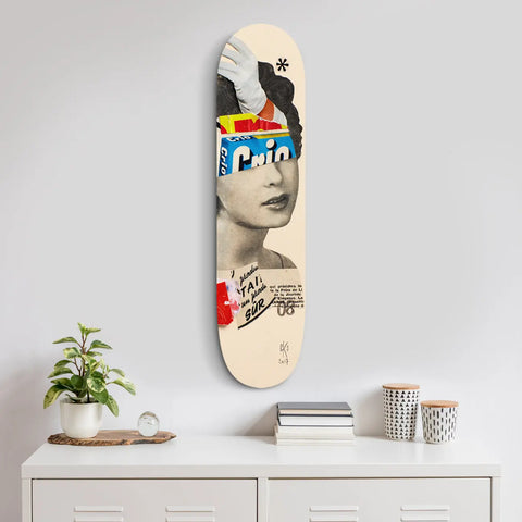 Artistic skateboard deck featuring a collage-style design with vintage portrait elements and abstract graphics.