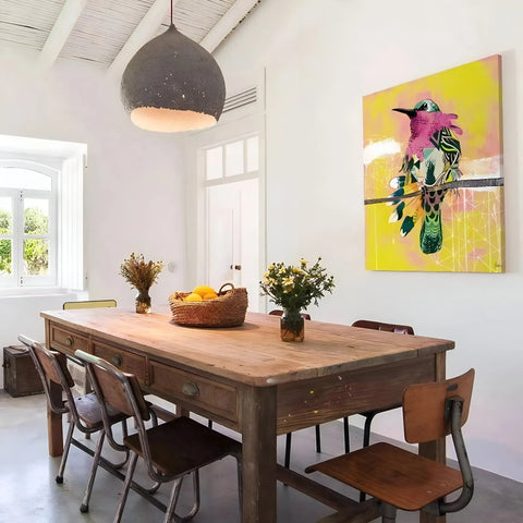 Wooden dining table with chairs in a bright interior setting.