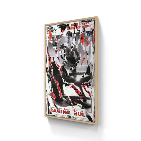 Framed abstract artwork featuring black, white, and red elements with text fragments visible.