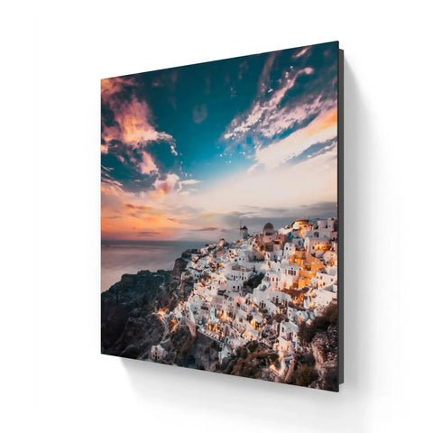 Framed Santorini cityscape print.