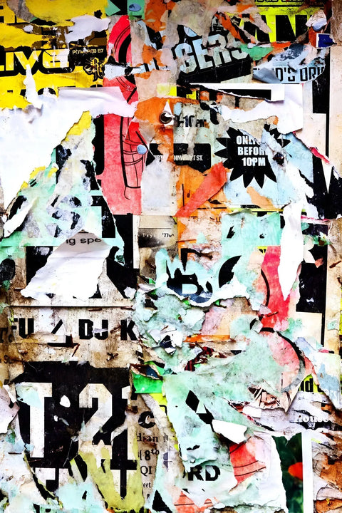 A close up of a bunch of posters on a wall
