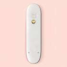 White skateboard deck with a small circular yellow logo.