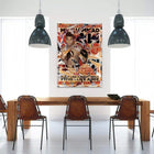 Colorful, collage-style poster featuring a boxer, hung on a white wall between two pendant lights.