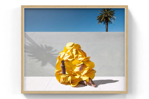 A vibrant yellow, ruffled garment with a voluminous, layered design.