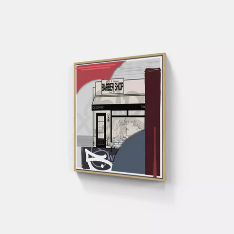A framed print of a building with a red and white stripe