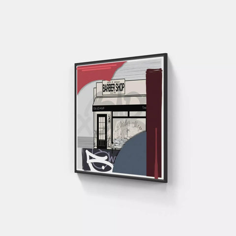 A framed print of a building with a red and white stripe