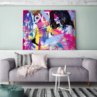 A living room with a couch and a painting on the wall