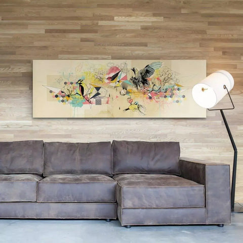 A couch with a painting on the wall