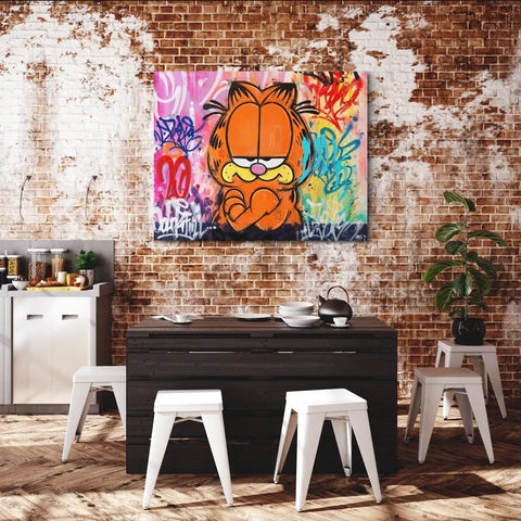 A dining room with a brick wall and a painting on the wall
