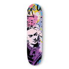 Skateboard deck featuring pop art-style portrait artwork in pink and purple tones.