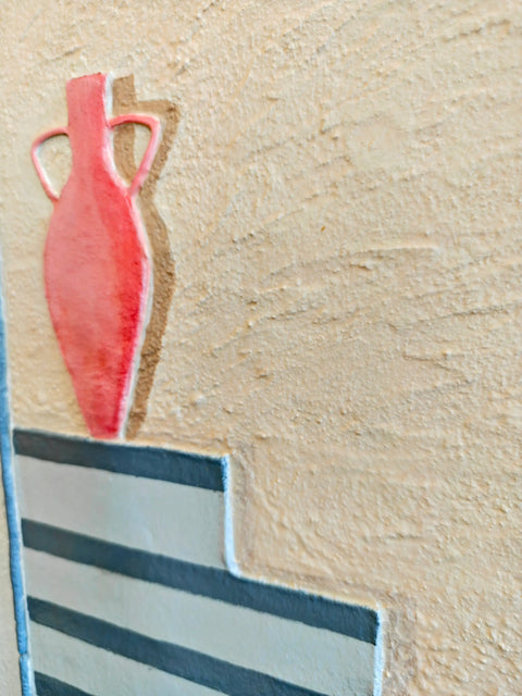 Red vase with handles.