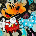 Mickey mouse and minnie mouse are standing next to each other