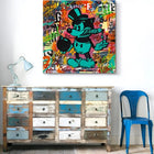 Distressed vintage dresser with multi-colored drawers and weathered paint finish.