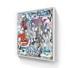 Collage-style artwork featuring a central face surrounded by colorful text and graphic elements in a framed canvas format.