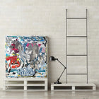Colorful, collage-style artwork featuring mixed media and text on a canvas.