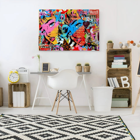 Vibrant pop art canvas featuring colorful graffiti-style artwork with abstract faces and text.