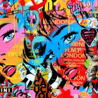 Vibrant pop art graffiti featuring stylized faces with bright pink and blue tones amid text and street art elements.