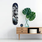 Skateboard deck featuring a black and white portrait of a gorilla.
