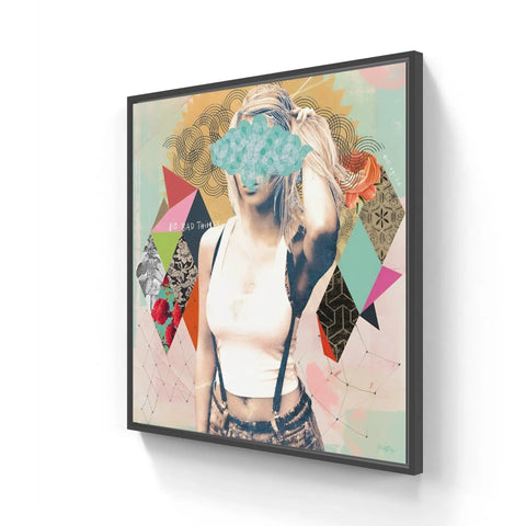 A framed canvas with a woman’s face and colorful geometric shapes