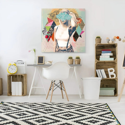 A white desk with a white chair and a painting on the wall