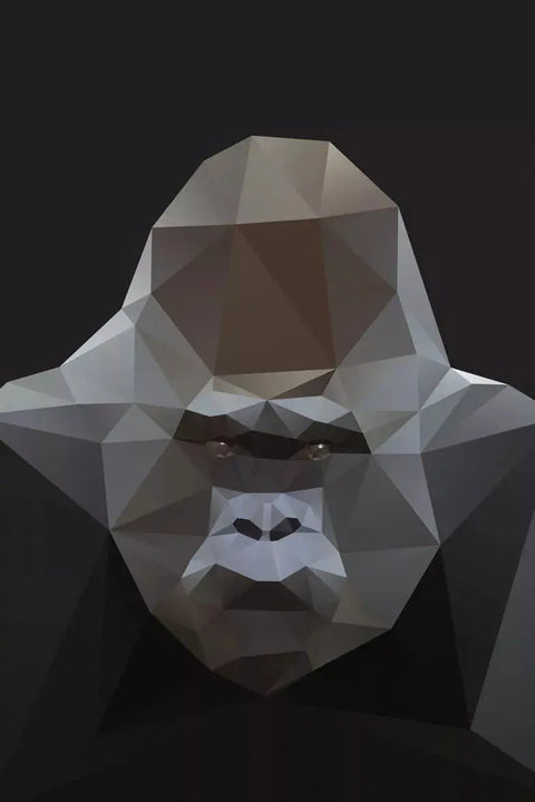 A close up of a gorilla’s face with a low polygonal background
