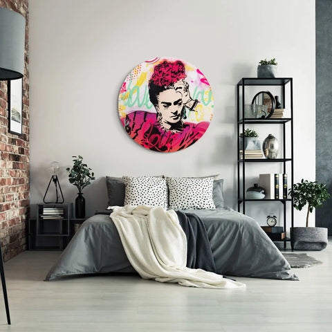 A bedroom with a large wall art piece