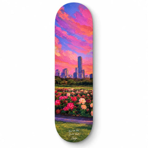 A skateboard deck with a vibrant painterly city skyline at sunset over pink and red roses new farm park australia keepsake
