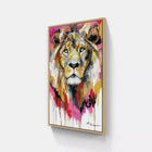 Colorful abstract painting of a lion’s face in a wooden frame.