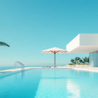 By the pool aluminium wall art featuring an infinite blue infinity pool with clear water and white concrete edges