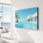 A sleek aluminium wall art titled by the pool showing a vibrant infinity pool and ocean view on a modern wall-mounted tv