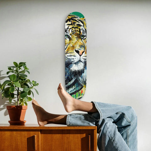 Skateboard deck featuring a vibrant tiger face design.