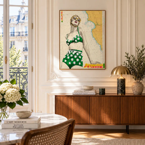 A framed st yves limited edition aluminium artwork of a woman in a green floral bikini on a vintage map background