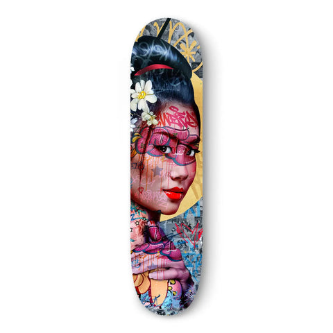 Skateboard deck featuring colorful geisha-inspired street art with flowers and graffiti elements.