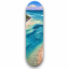 A skateboard deck featuring a vibrant painterly coastal scene with turquoise waters and sandy beaches titled tallebudgera creek australia keepsake fakeboard