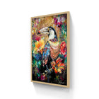 Vibrant abstract painting of a toucan surrounded by colorful flowers, framed in light wood.