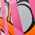 A close up of a pink and orange abstract painting