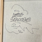 A framed painting with a handwritten message