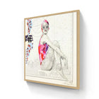 A framed artwork featuring a stylized illustration of a woman in a vibrant pink and purple swimsuit with sunglasses, set against a nautical chart background.