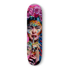 Colorful skateboard deck featuring a vibrant, surrealist portrait design.