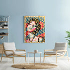 A living room with a blue wall and a painting on the wall